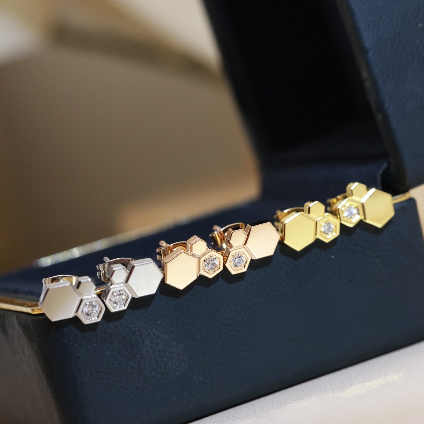 Signature Emblem Stud Earrings in Polished Metal-Tone – Design 001 styled product view