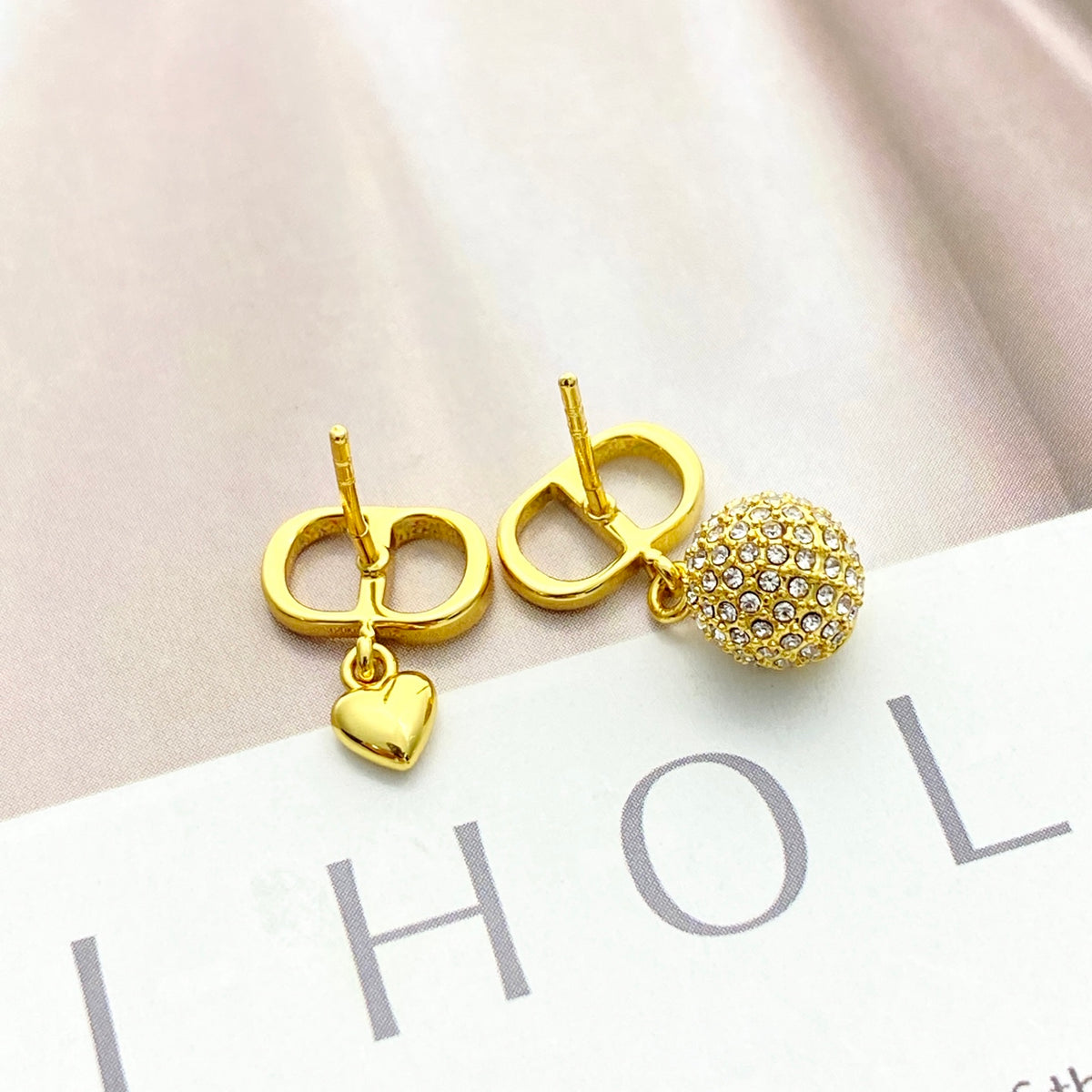 Heart Motif Stud Earrings in Gold-Tone with Crystal-Style Accents close-up detail