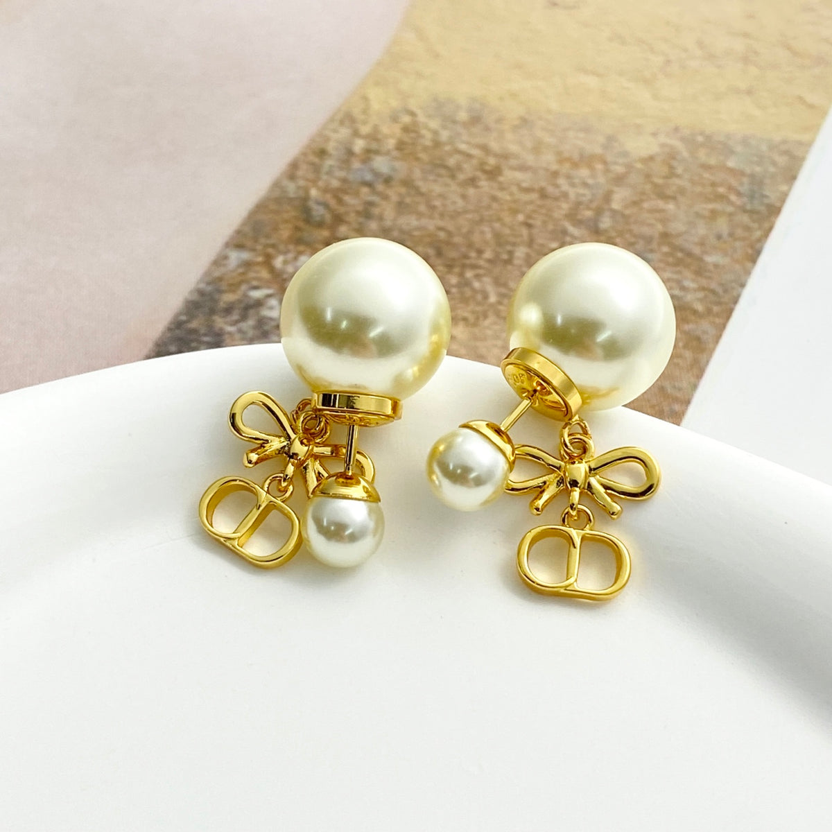 Bow & Butterfly Motif Stud Earrings in Gold-Tone with Pearl-Style Detail – Design 001 main product view