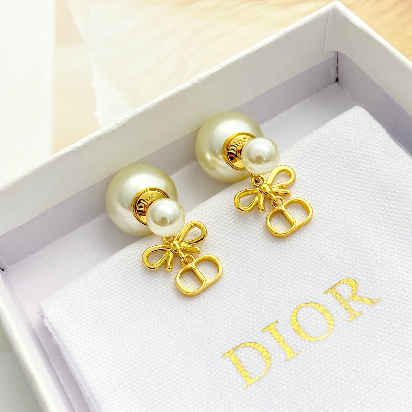Bow & Butterfly Motif Stud Earrings in Gold-Tone with Pearl-Style Detail – Design 001 close-up detail