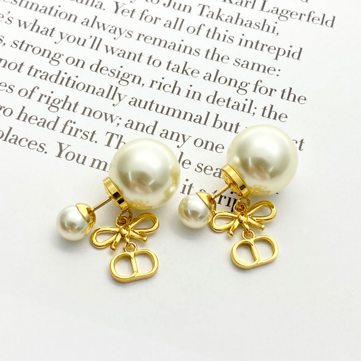 Bow & Butterfly Motif Stud Earrings in Gold-Tone with Pearl-Style Detail – Design 001 front view