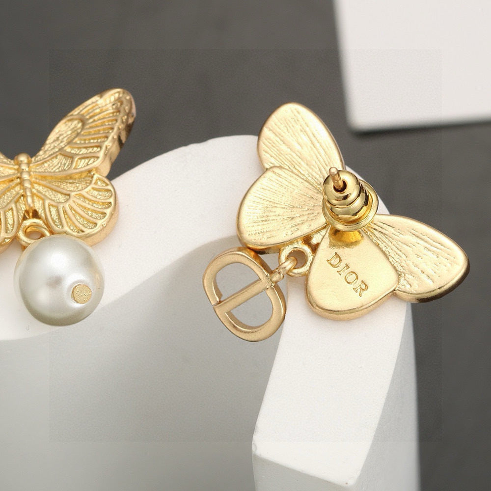 Bow & Butterfly Motif Stud Earrings in Silver-Tone with Asymmetric Detail – Design 002 front view
