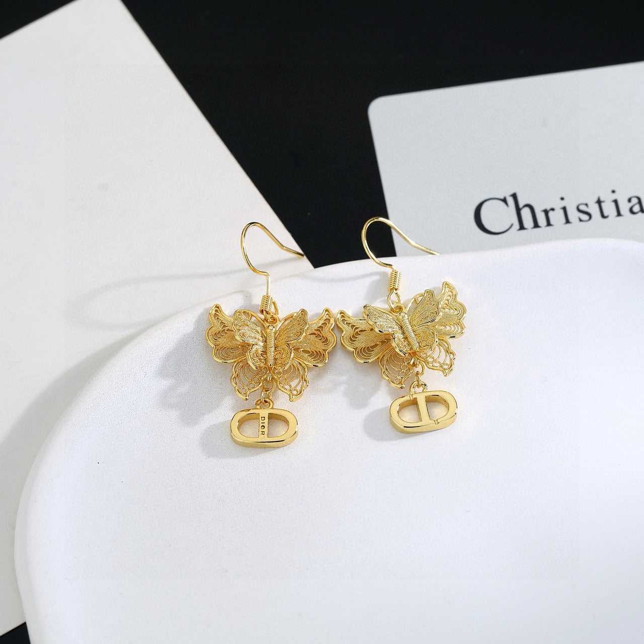 Bow & Butterfly Motif Stud Earrings in Polished Metal-Tone – Design 001 close-up detail