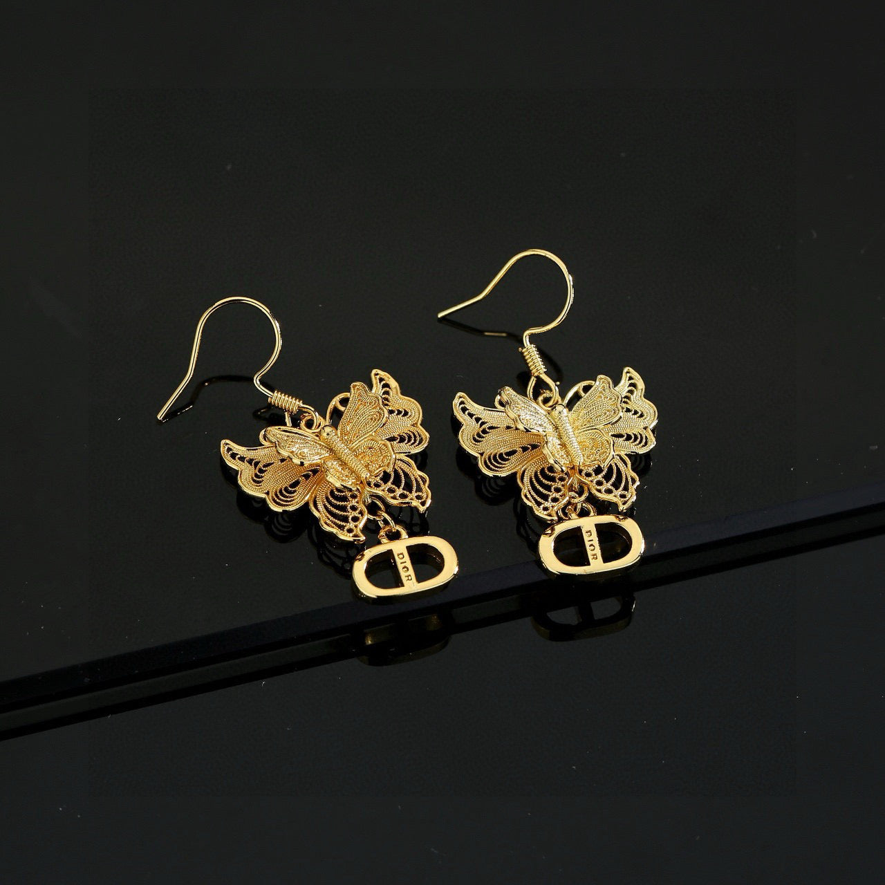 Bow & Butterfly Motif Stud Earrings in Polished Metal-Tone – Design 002 detail view