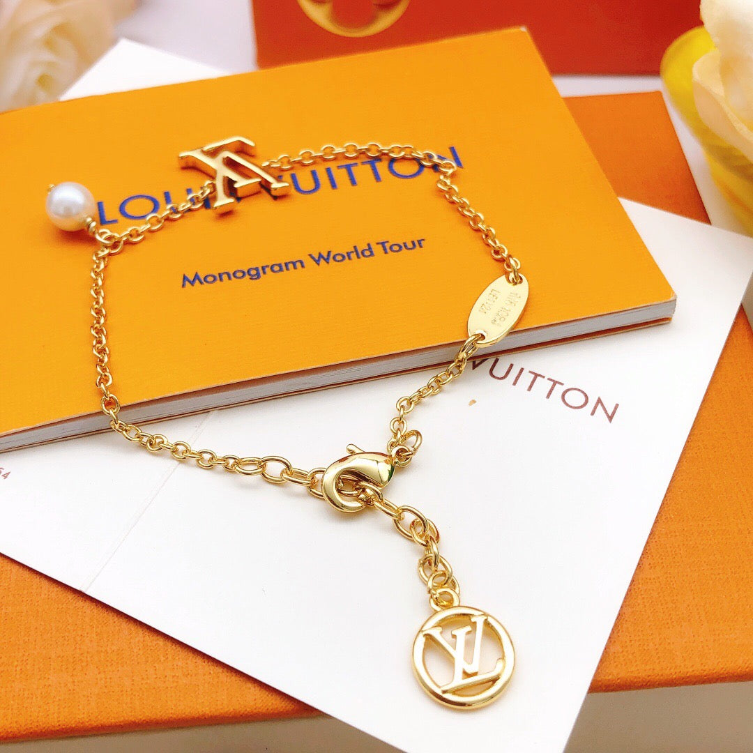 Geometric Emblem Bracelet in Gold-Tone – Pearl Detail detail view