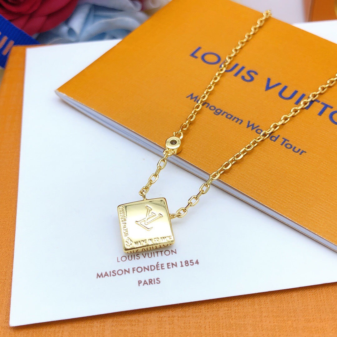 Geometric Emblem Pendant Necklace in Gold-Tone – White Detail detail view
