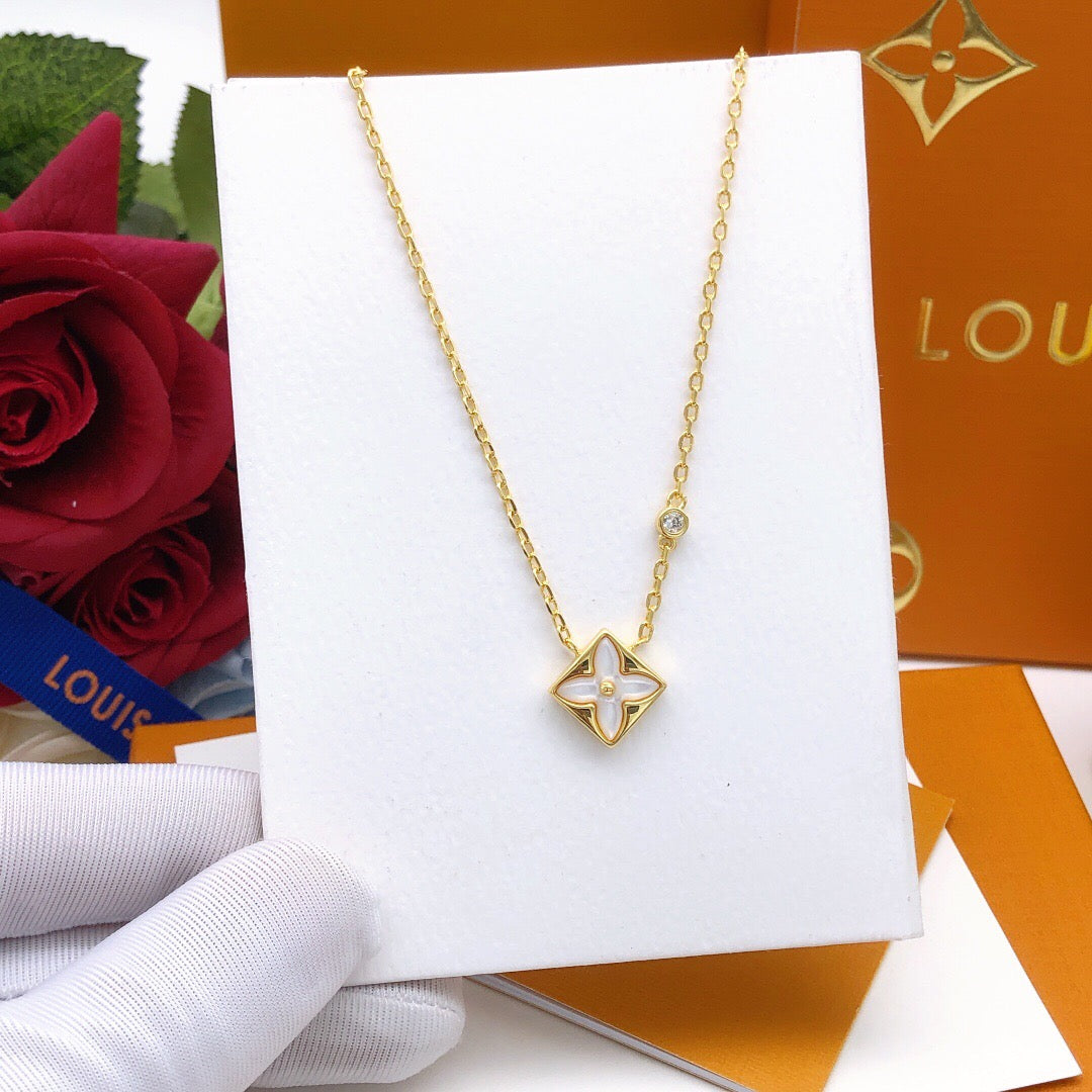 Geometric Emblem Pendant Necklace in Gold-Tone – White Detail styled product view
