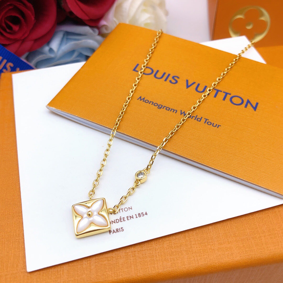 Geometric Emblem Pendant Necklace in Gold-Tone – White Detail front product view