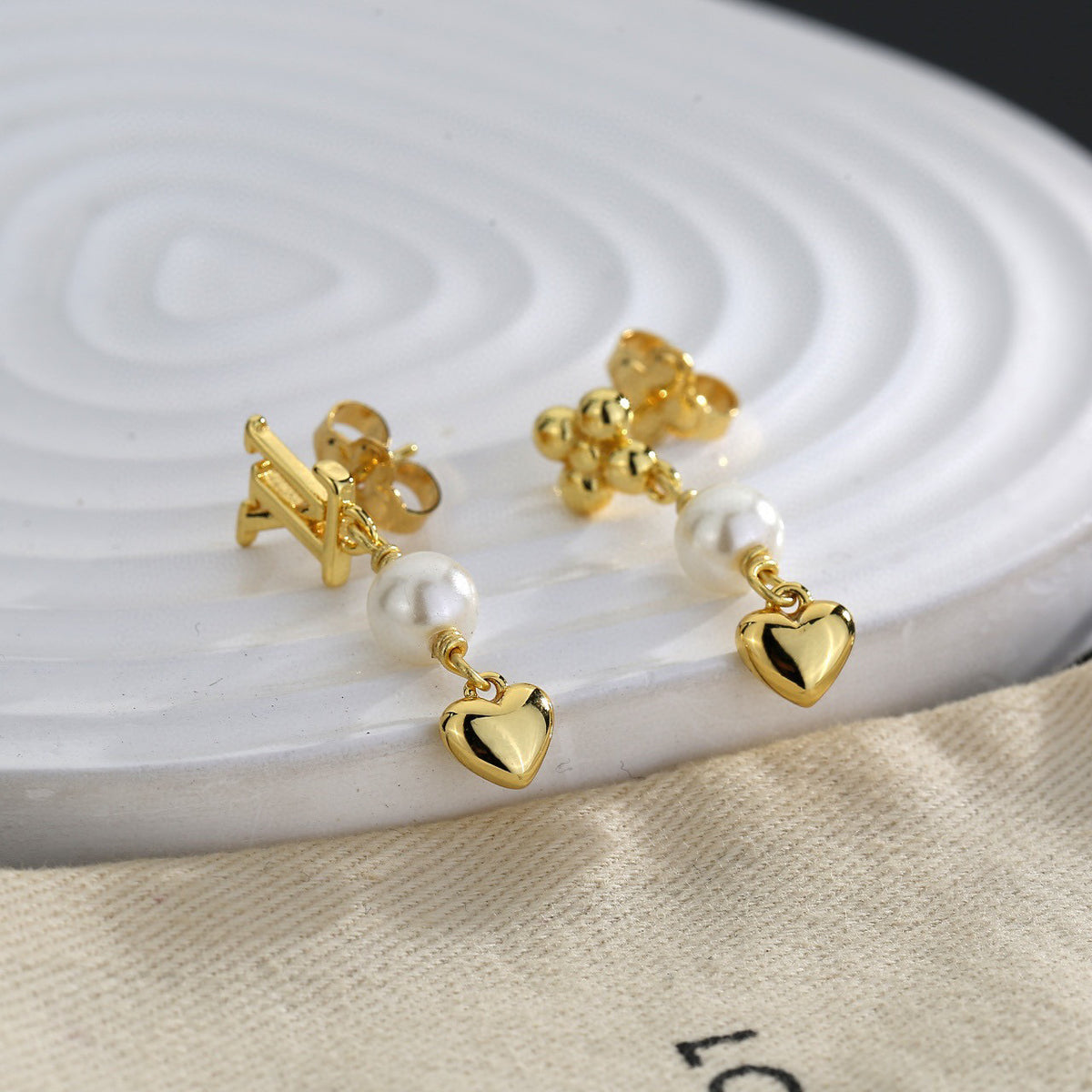 Letter Emblem Stud Earrings in Polished Metal-Tone – Design 004 main product view