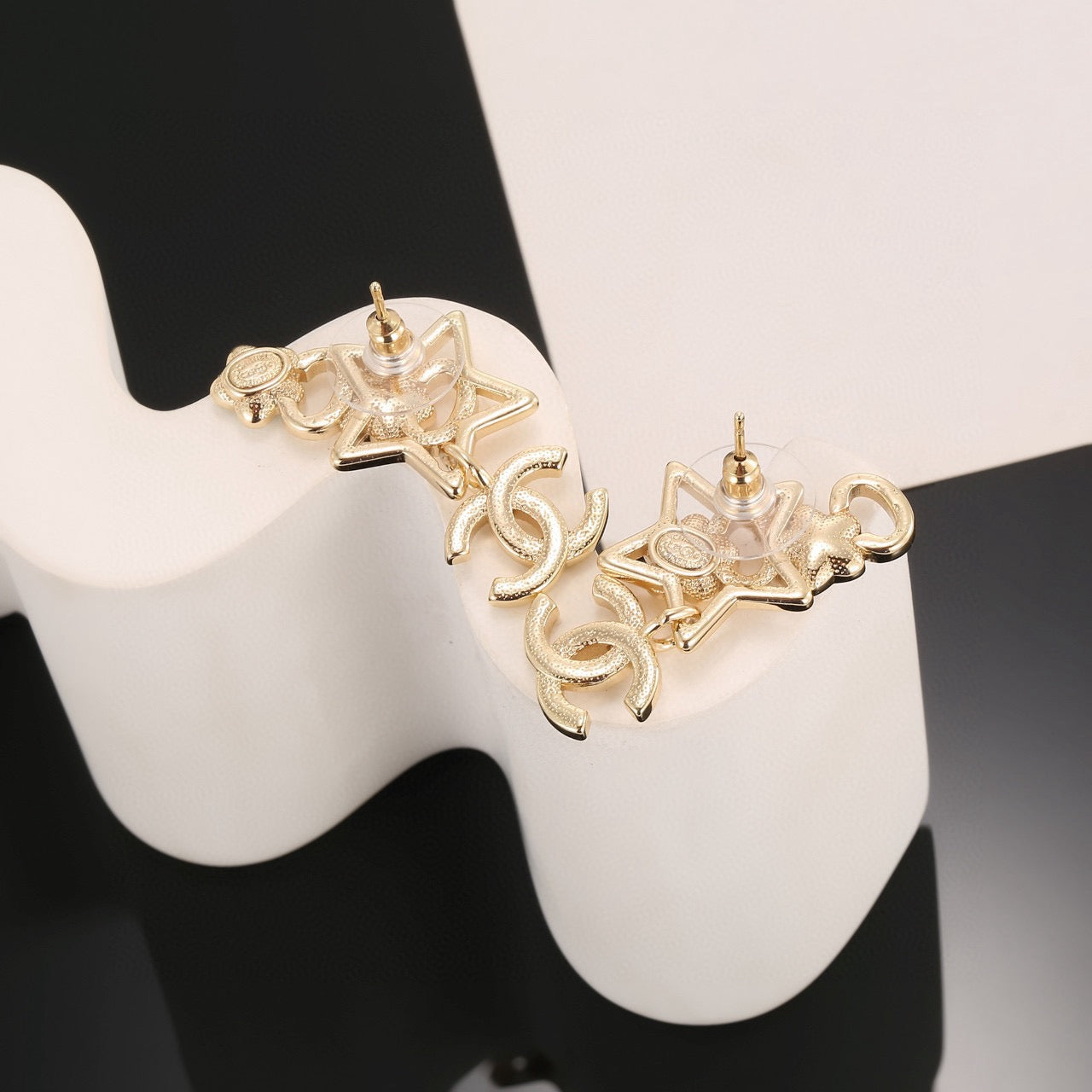 Double-C Emblem Stud Earrings in Gold-Tone – Star Detail detail view