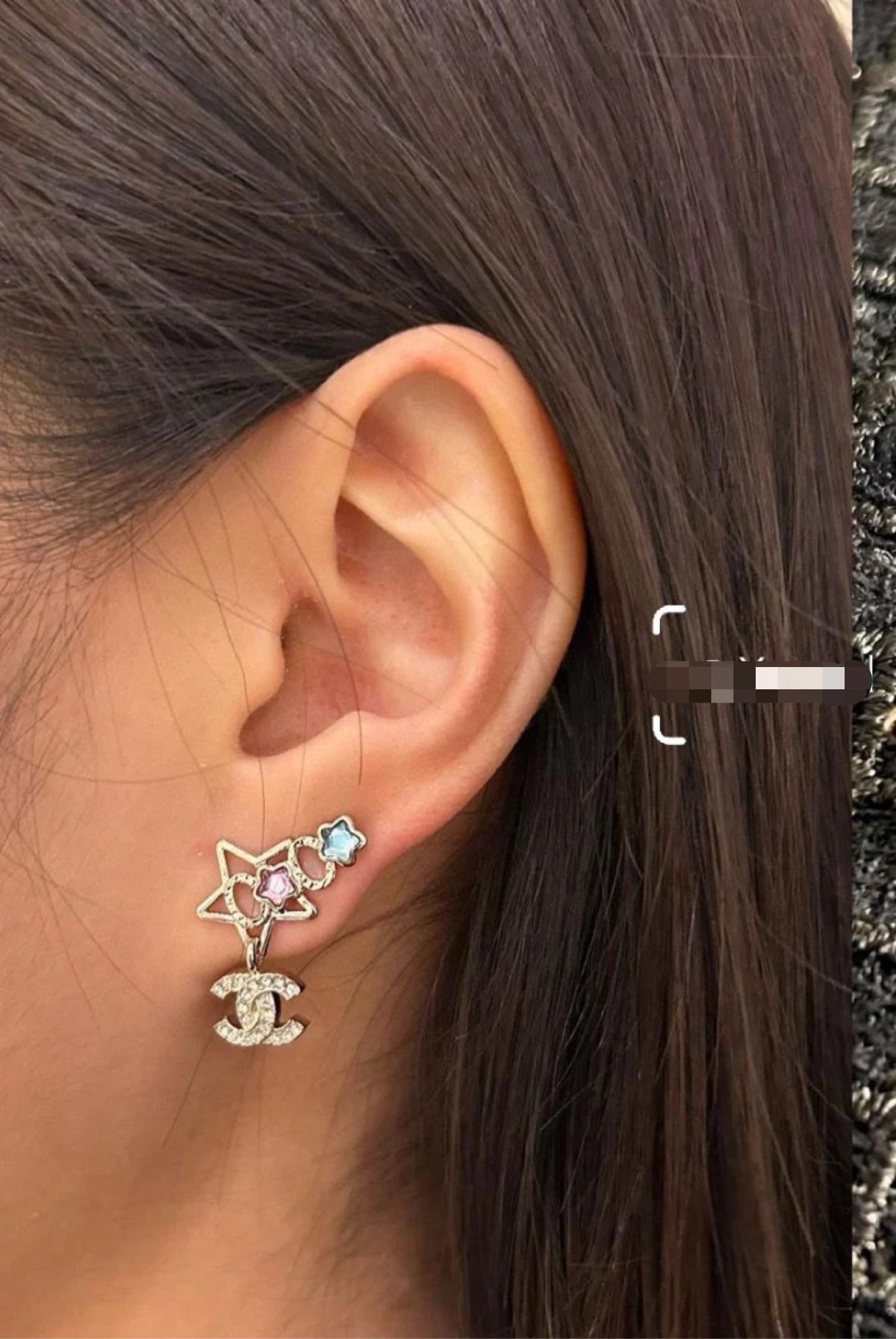 Double-C Emblem Stud Earrings in Gold-Tone – Star Detail close-up detail