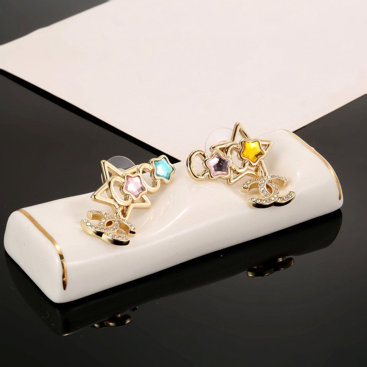Double-C Emblem Stud Earrings in Gold-Tone – Star Detail – Design 002 side detail