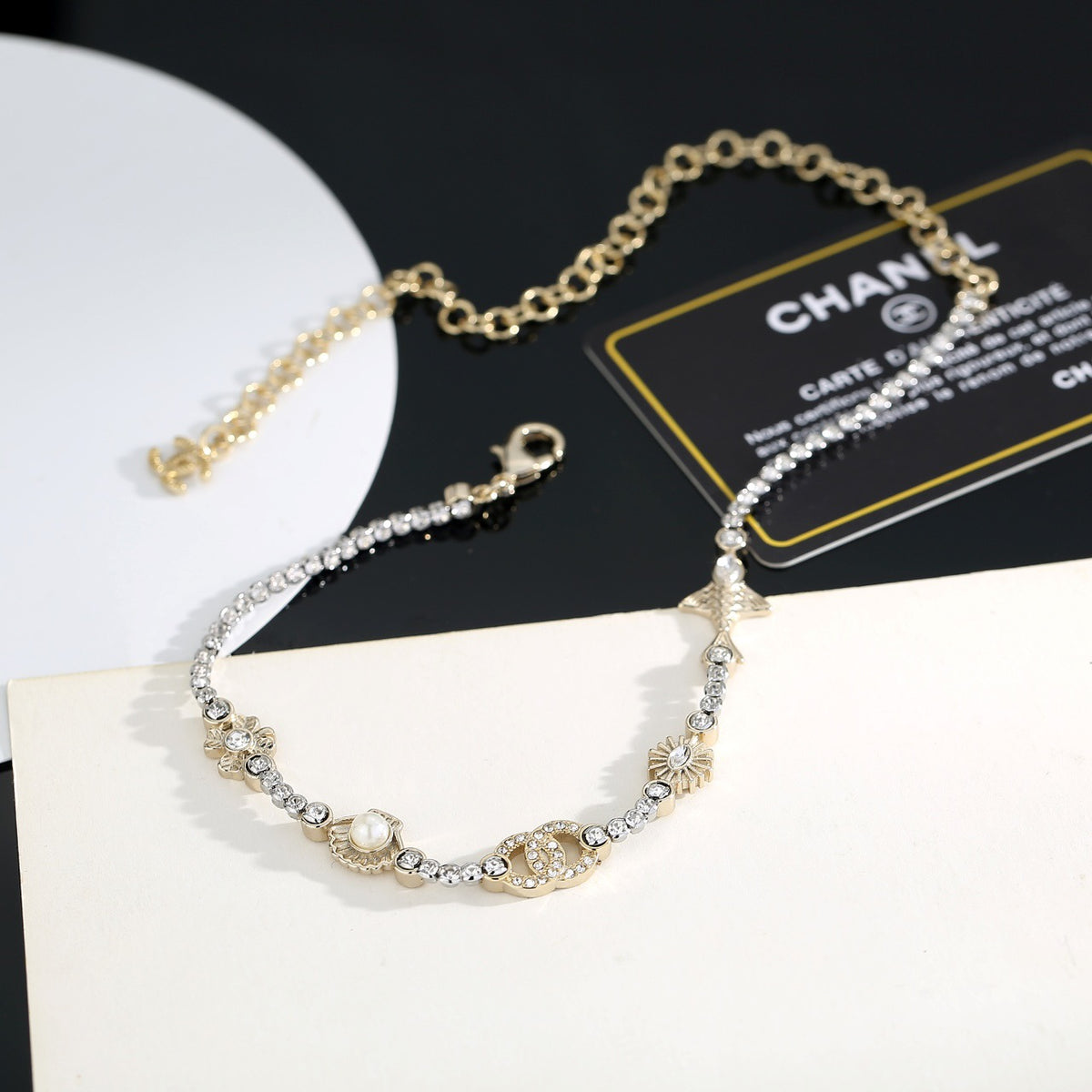 Double-C Emblem Pearl-Detail Pendant Necklace – Pearl Detail close-up detail