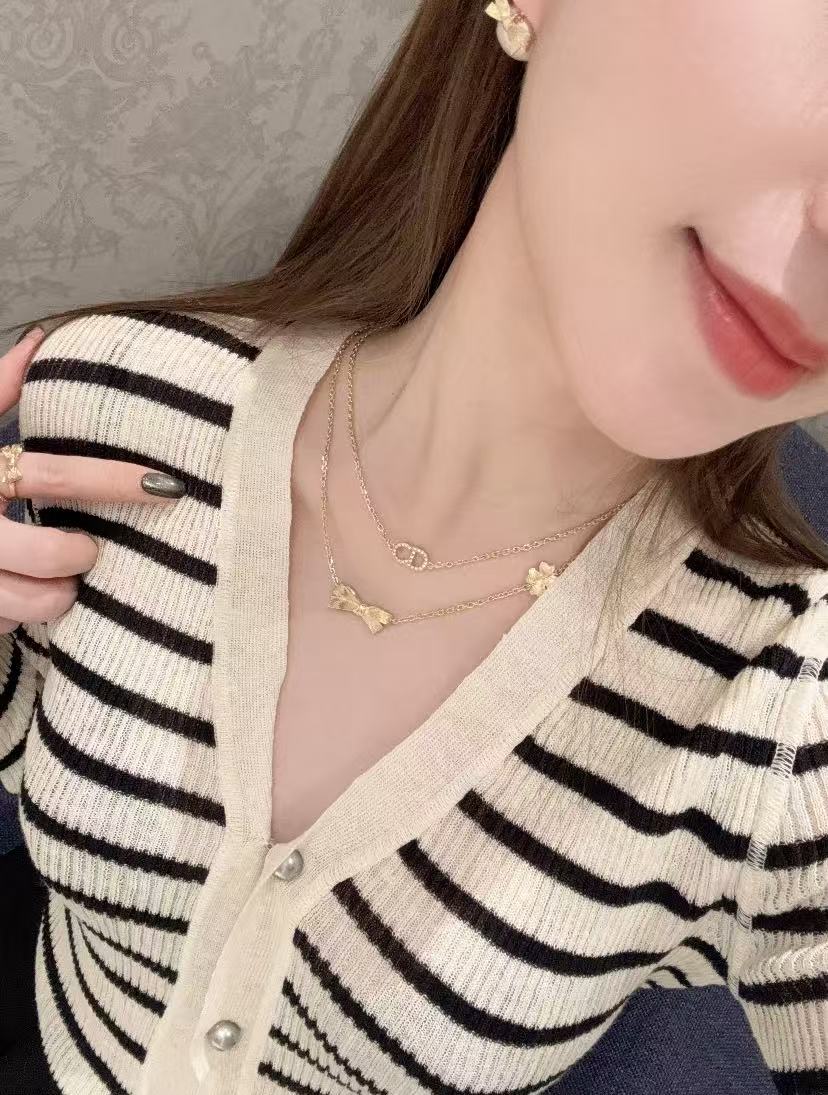 Bow & Butterfly Motif Pendant Necklace in Polished Metal-Tone with Layered Detail – Design 002 styled view