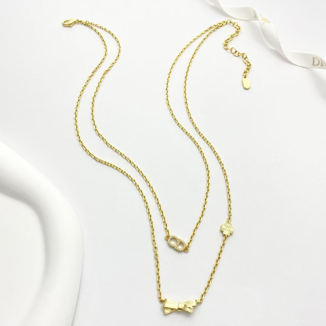 Bow & Butterfly Motif Pendant Necklace in Polished Metal-Tone with Layered Detail – Design 001 front view