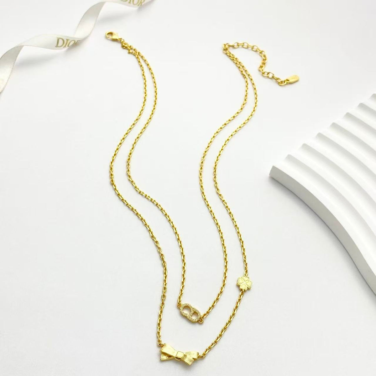 Bow & Butterfly Motif Pendant Necklace in Polished Metal-Tone with Layered Detail – Design 001 main product view