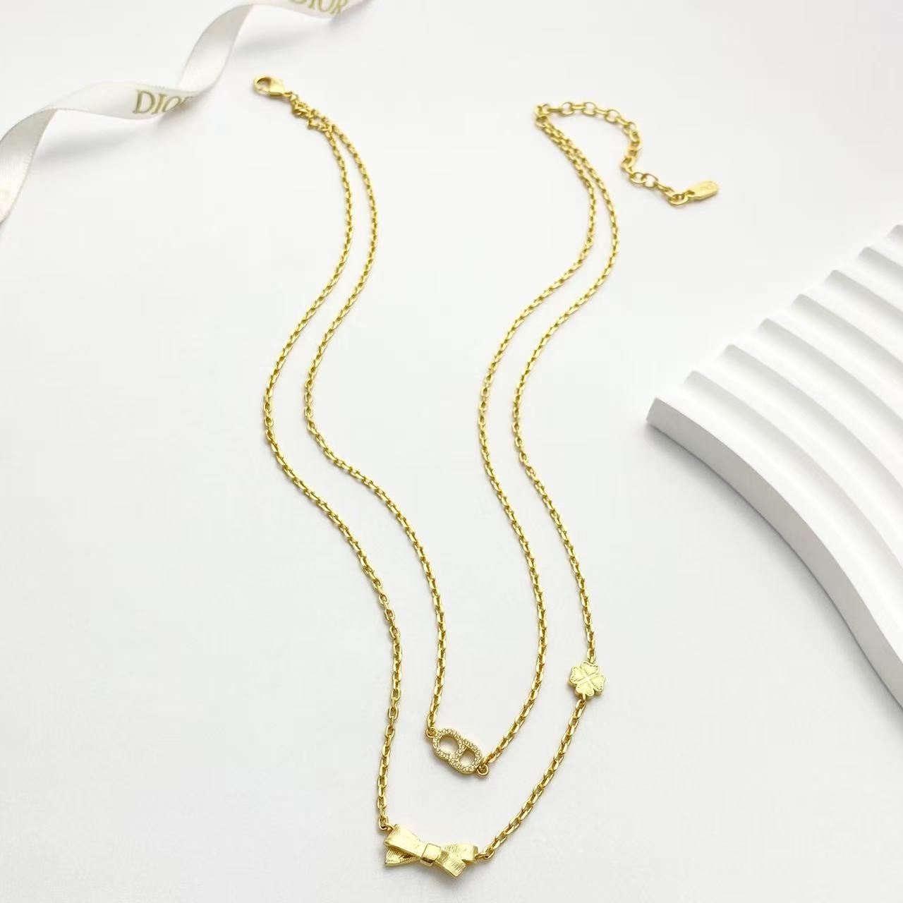 Bow & Butterfly Motif Pendant Necklace in Polished Metal-Tone with Layered Detail – Design 001 main product view