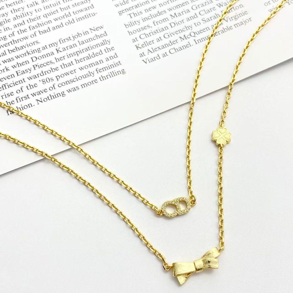 Bow & Butterfly Motif Pendant Necklace in Polished Metal-Tone with Layered Detail – Design 002 close-up detail