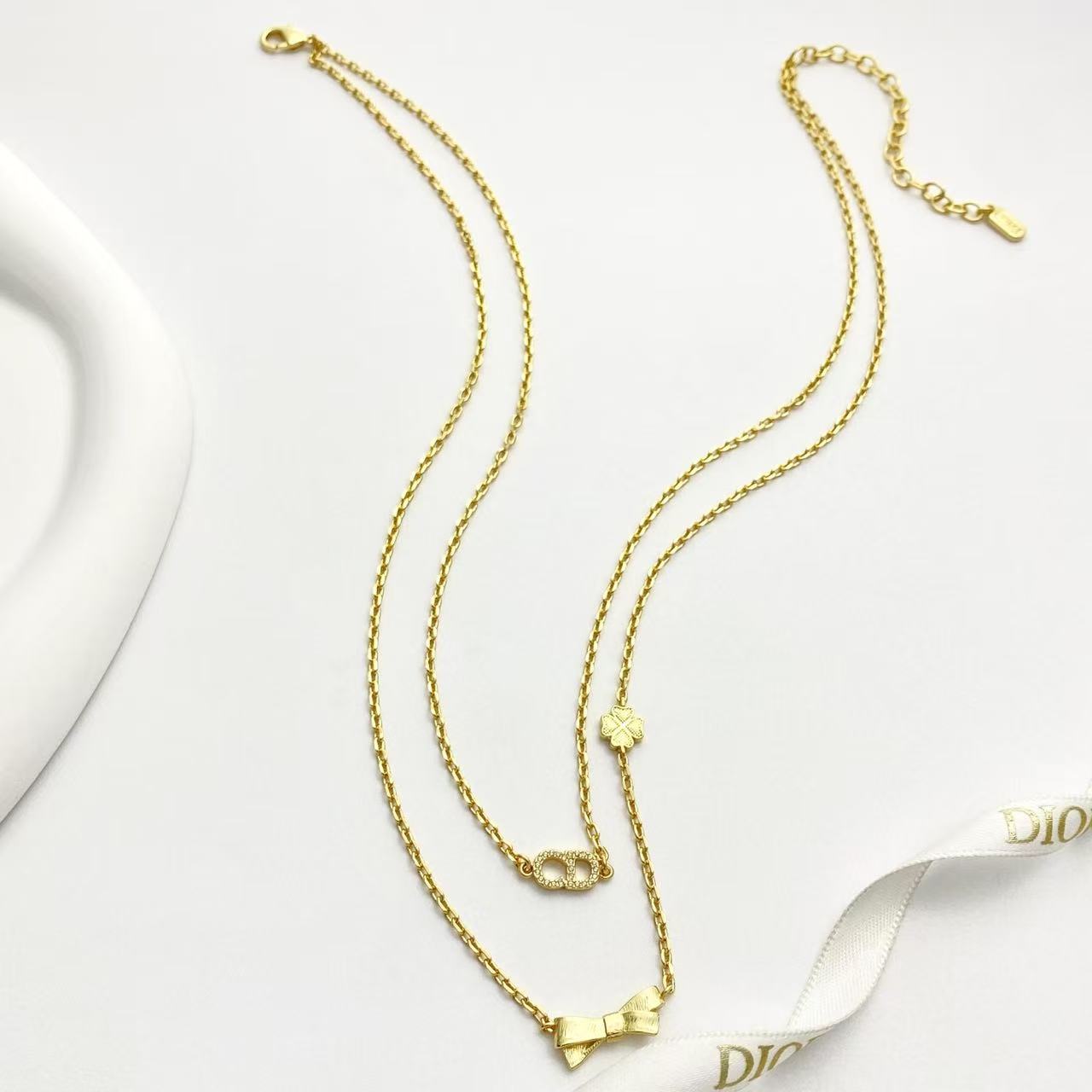 Bow & Butterfly Motif Pendant Necklace in Polished Metal-Tone with Layered Detail – Design 002 detail view