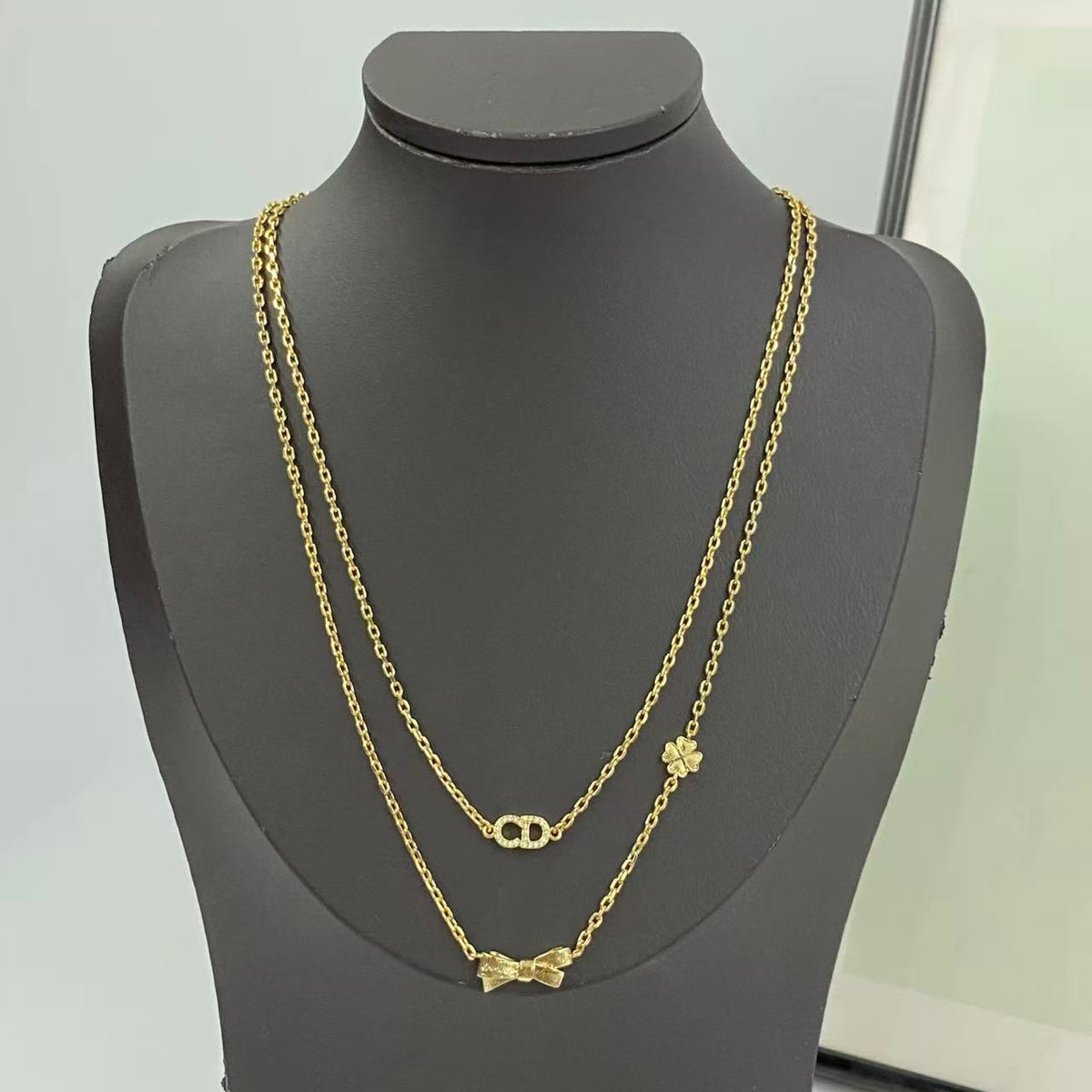 Bow & Butterfly Motif Pendant Necklace in Polished Metal-Tone with Layered Detail – Design 002 main product view