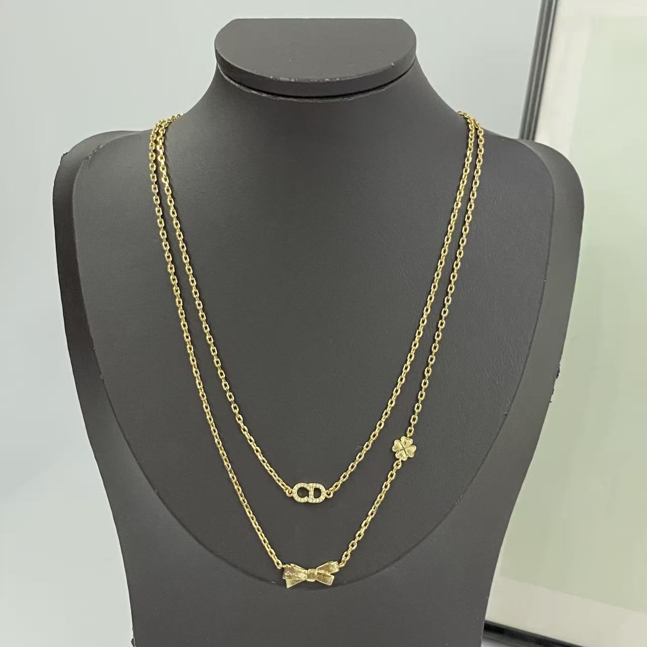 Bow & Butterfly Motif Pendant Necklace in Polished Metal-Tone with Layered Detail – Design 002 main product view
