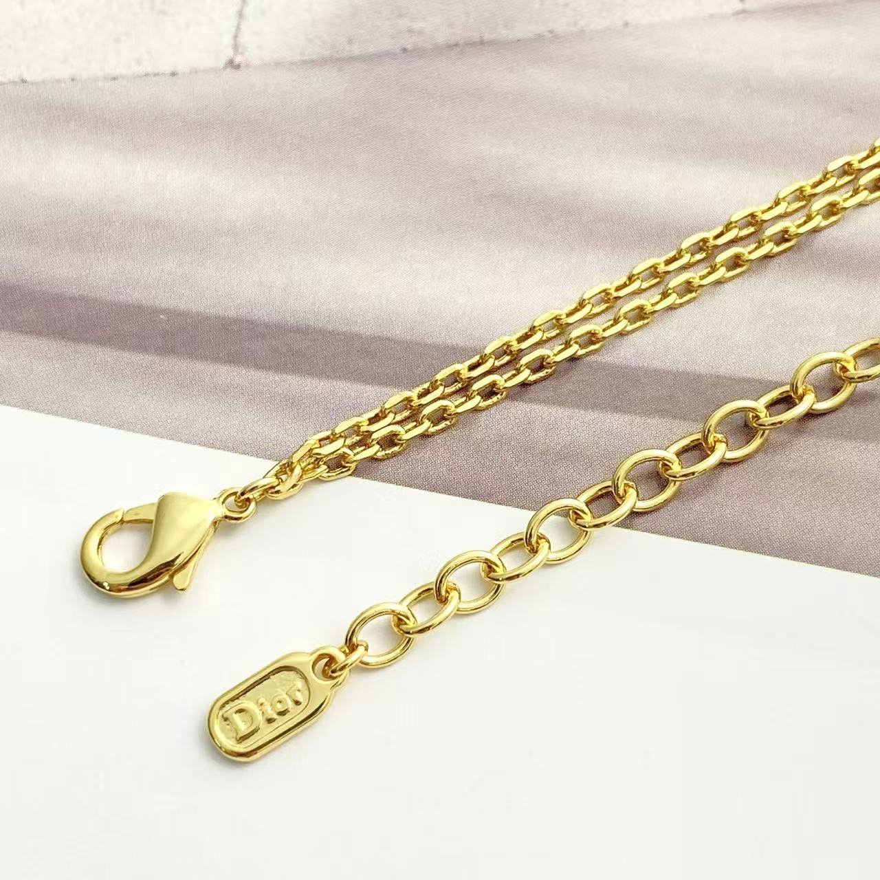 Bow & Butterfly Motif Pendant Necklace in Polished Metal-Tone with Layered Detail – Design 002 side detail