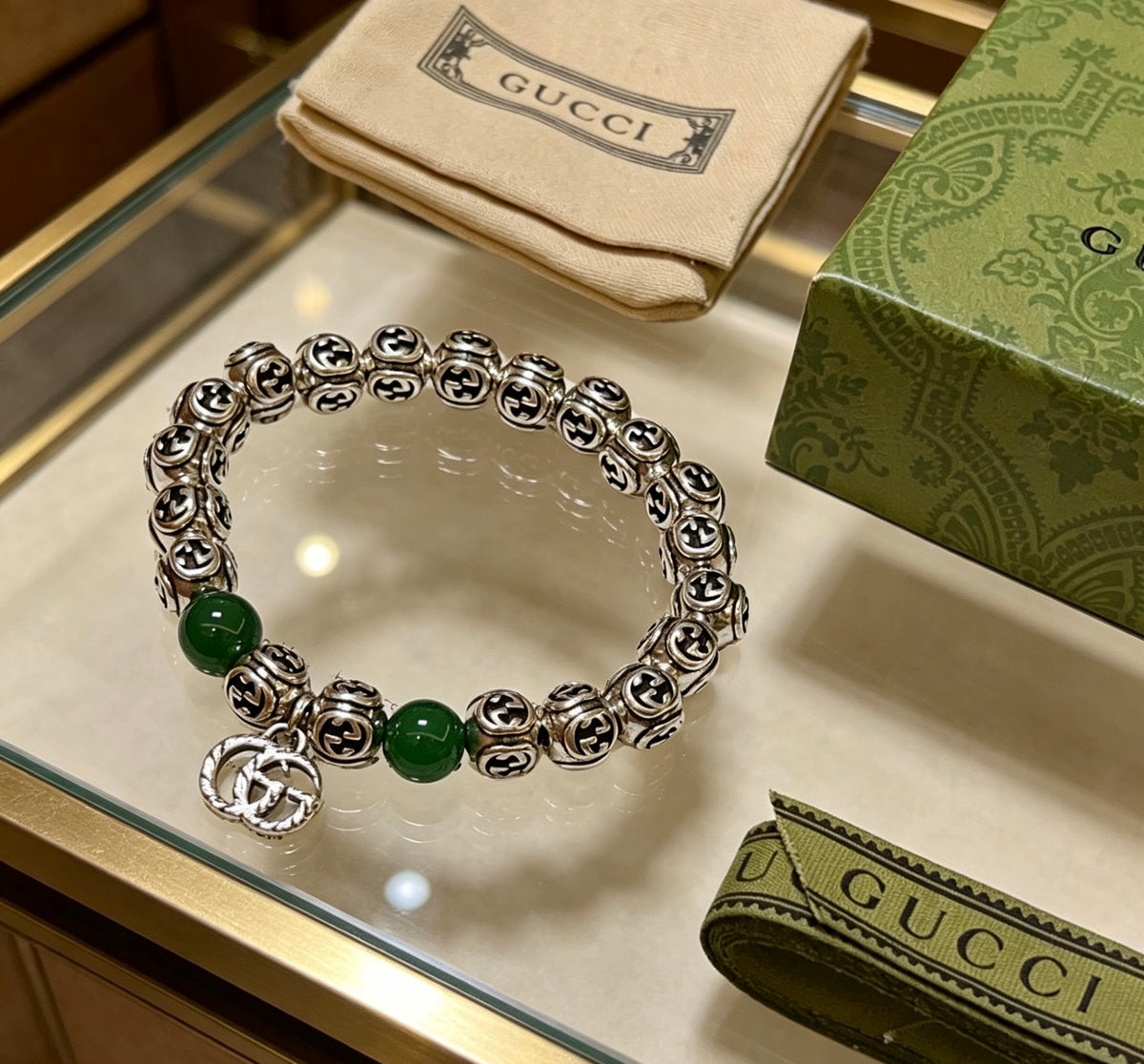 Double-G Emblem Beaded Bracelet in Polished Metal-Tone – Crystal Detail close-up detail