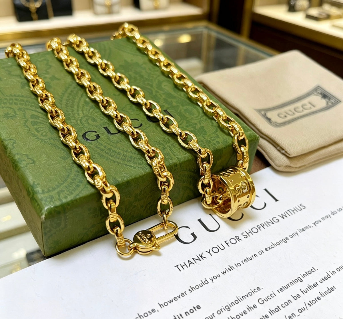 Double-G Emblem Pendant Necklace in Gold-Tone – Vintage Detail close-up detail